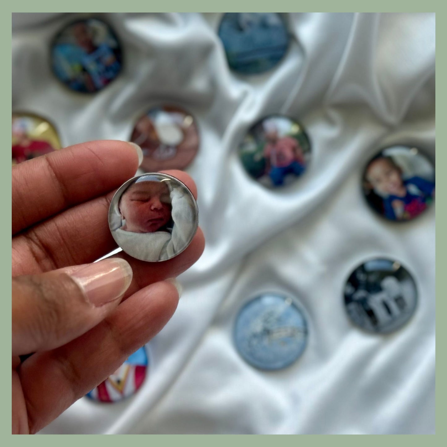 Hand holding a custom glass cabochon photo magnet featuring a newborn baby — personalized round fridge magnet with domed glass finish, perfect for memory keeping, baby announcements, or sentimental gifts