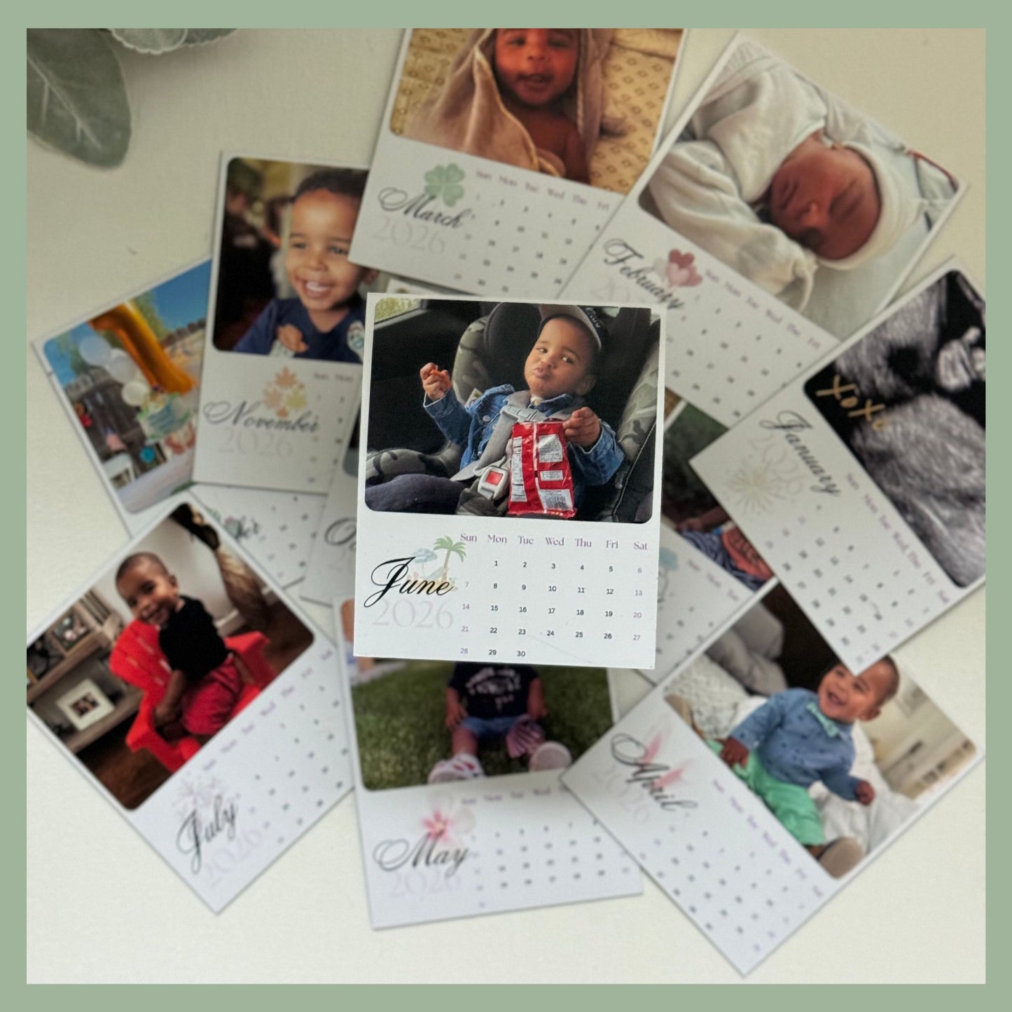 Monthly personalized photo calendar magnets displayed in a spread with family pictures, fridge gift