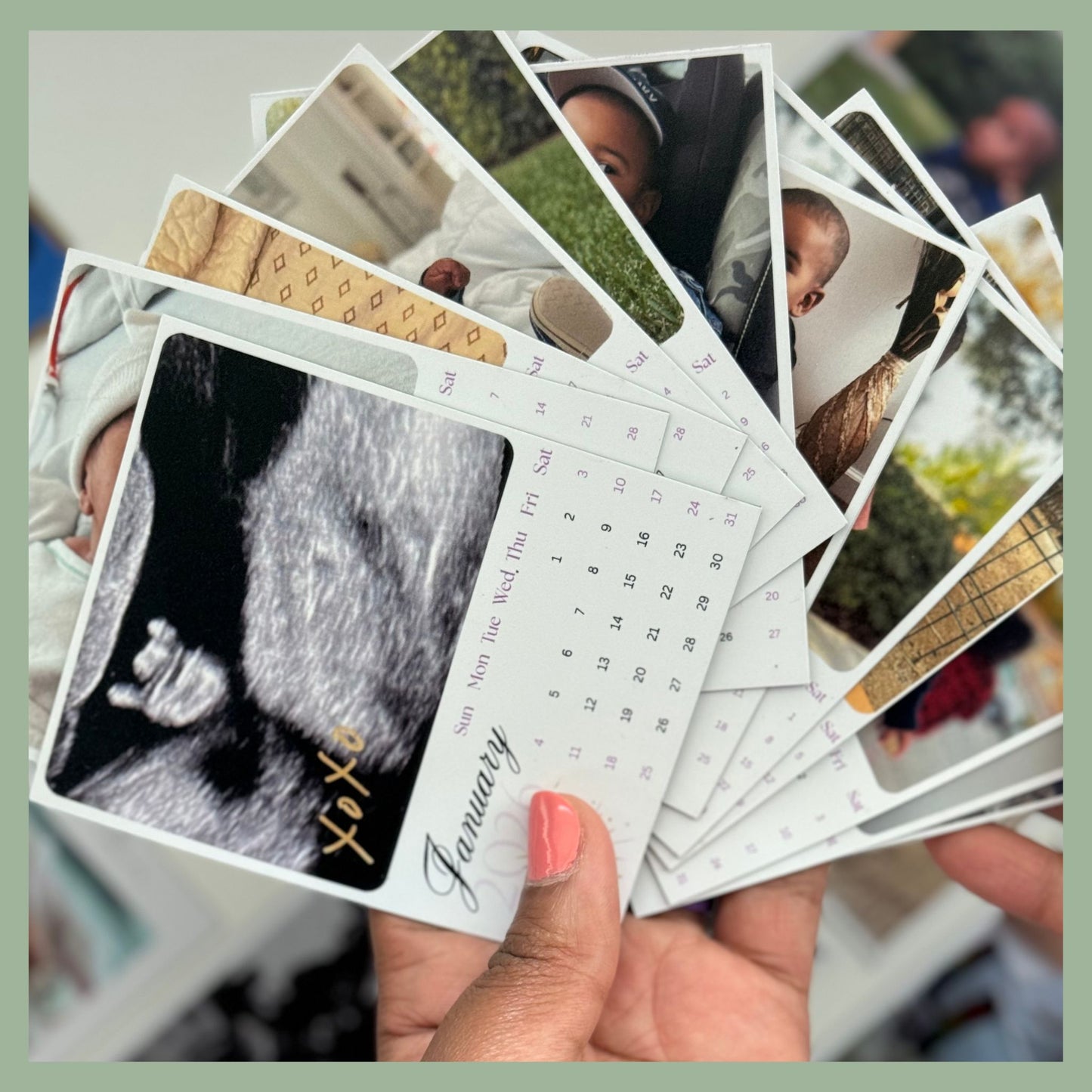 Fanned set of 12 custom photo calendar magnets held in hand, personalized family photo magnet