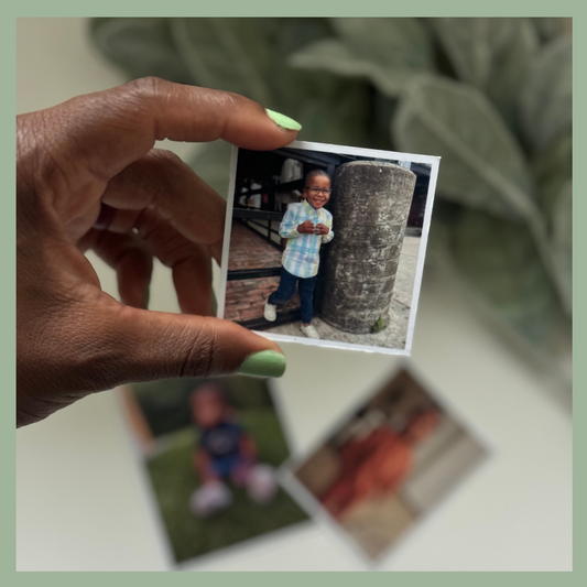 Custom square photo magnet held in hand featuring a smiling child next to a larger magnet on the surface, personalized fridge magnet