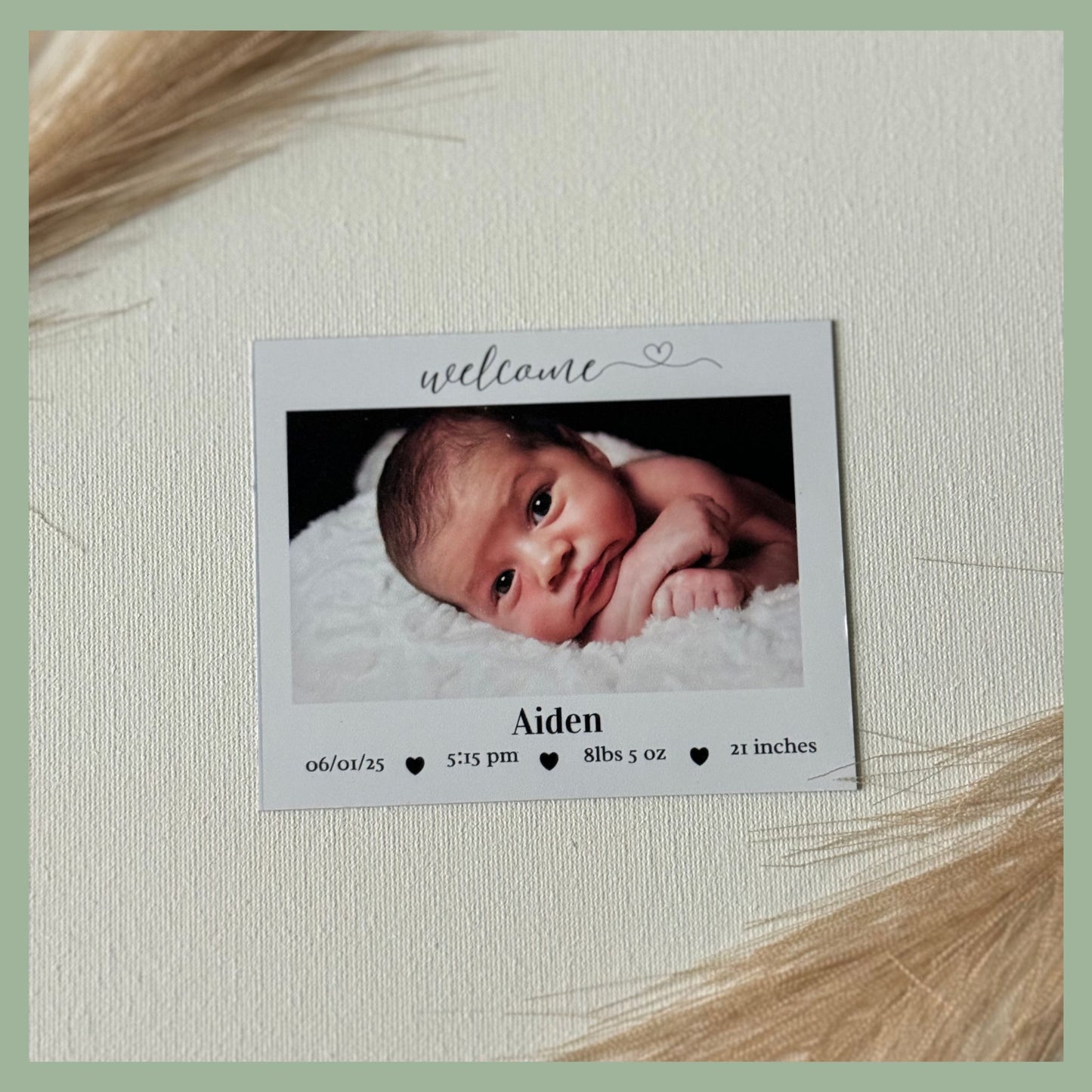 Custom newborn photo announcement magnet with baby name, birth date, and photo details